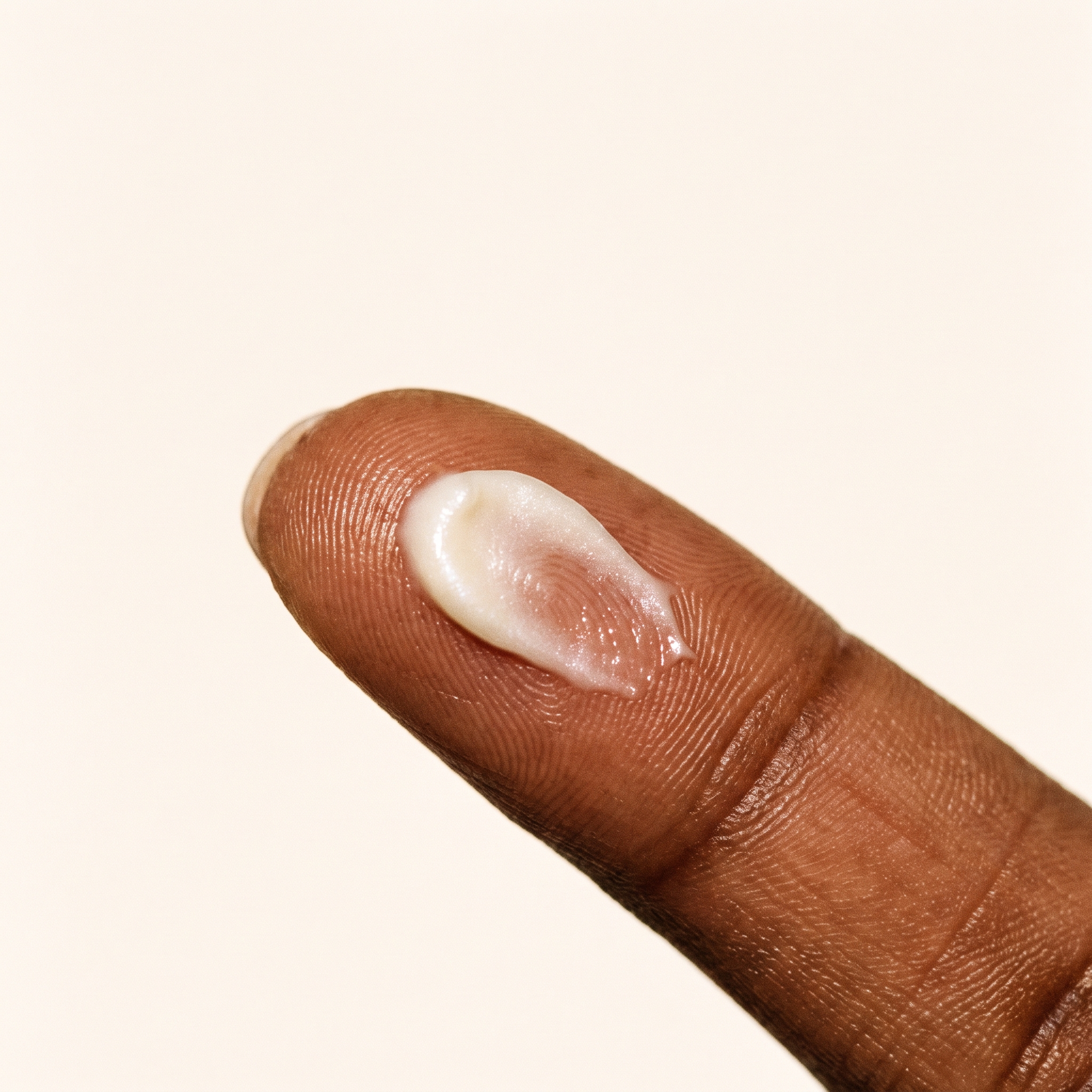 A dab of drip whipped body butter melting into skin