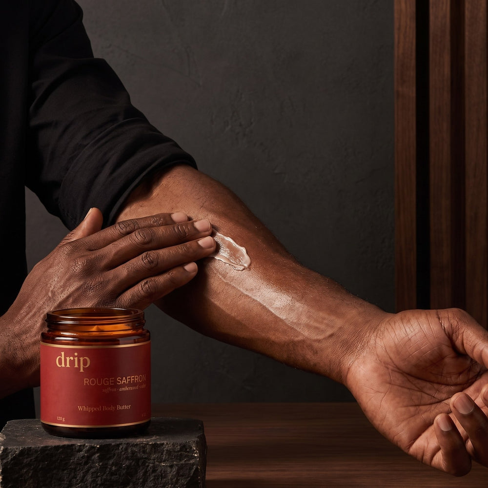 Smoothing drip body butter into the forearm